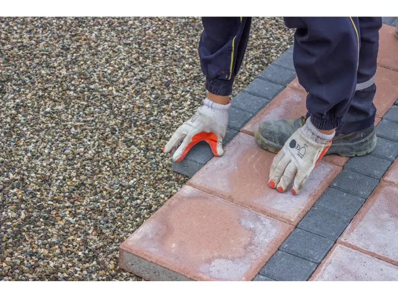 Installing pavers near a fence
